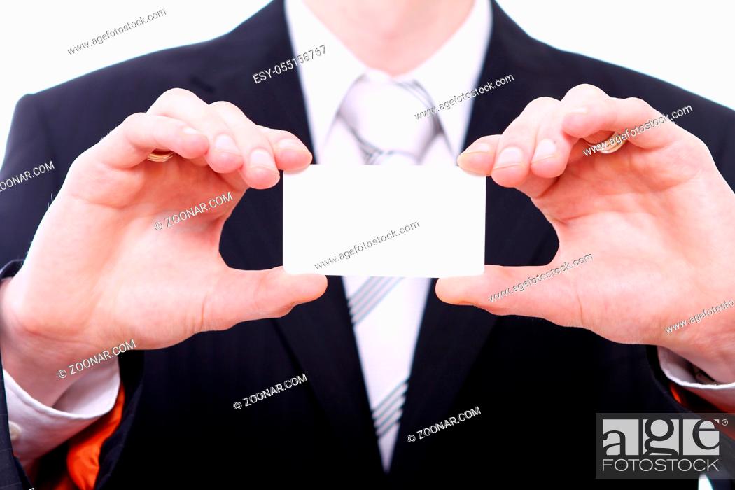 Imagen: Businessman holding empty bussines card in his hand.