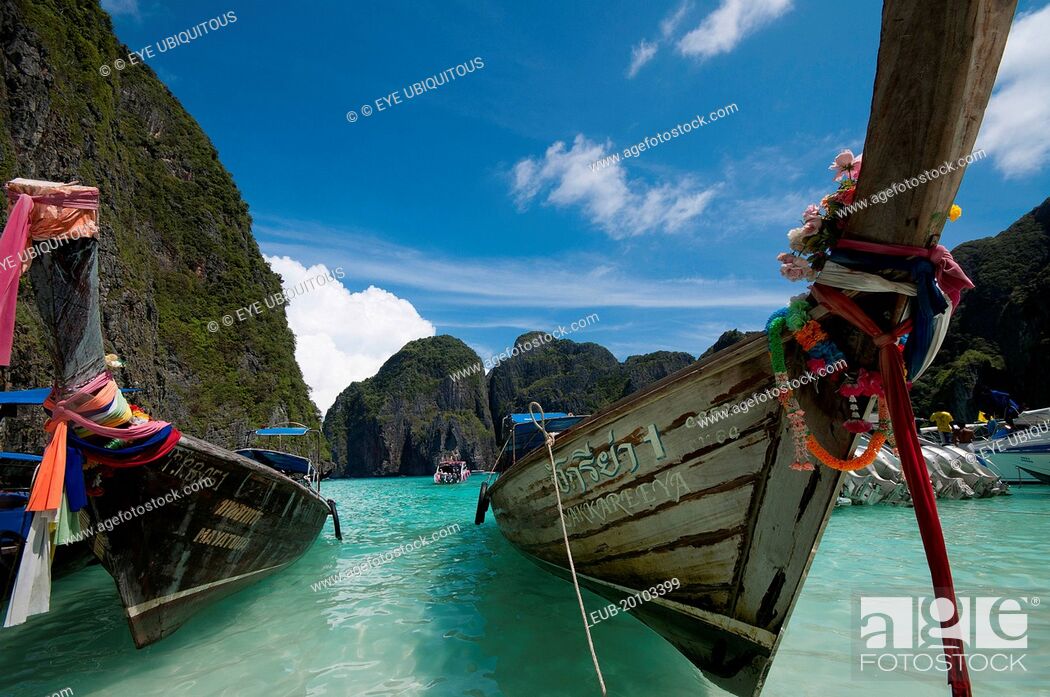 Stock Photo: Long Tailed boats tied up on the beach.