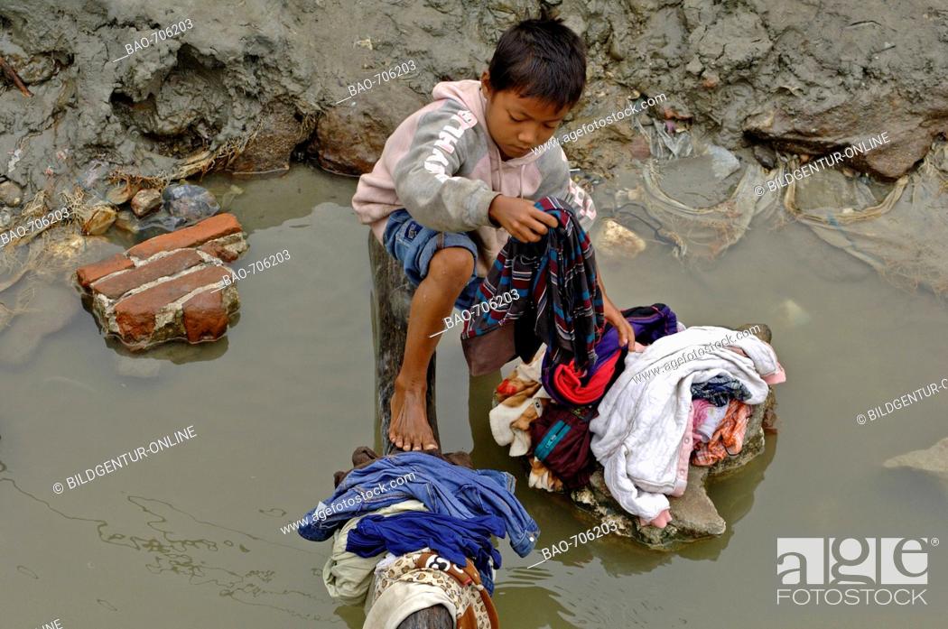 Stock Photo: washing clothes at river Irrawaddy, Burma.