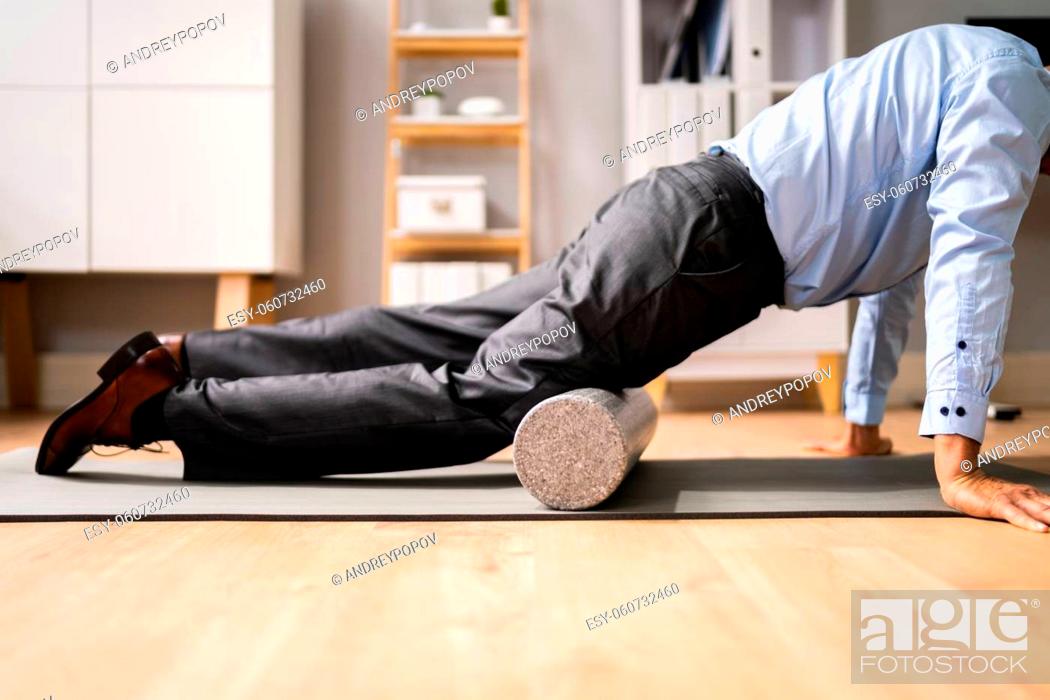Stock Photo: Foam Roller Quads Treatment And Muscle Pressure Release.