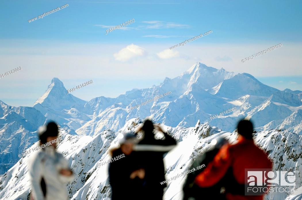 Stock Photo: Tourists look at the Alps with the Matterhorn (L) from the 2, 900 meter high Eggishorn on a sunny day in Fiesch, Germany, 06 February 2014.