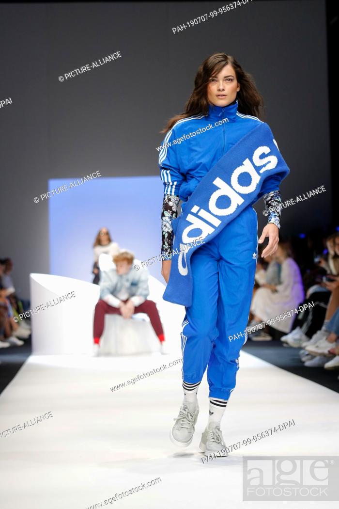 06 July 2019, Berlin: Models show fashion at the Adidas Show during the ...