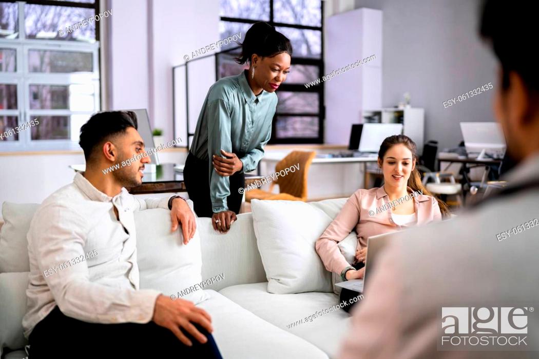 Stock Photo: Young Diverse People Working In Coliving Space.