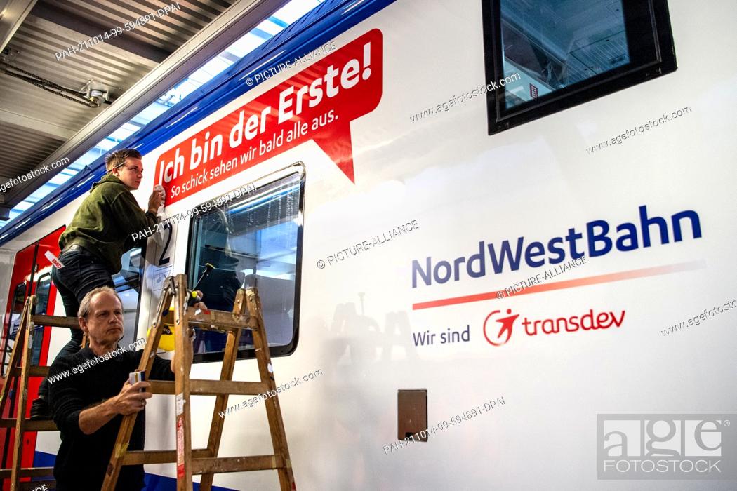 Stock Photo: 14 October 2021, Bremen, Bremerhaven: A sign reading ""I'm the first!"" is attached to a rebuilt Nordwestbahn train. A total of 34 trains of the Regio-S-Bahn.
