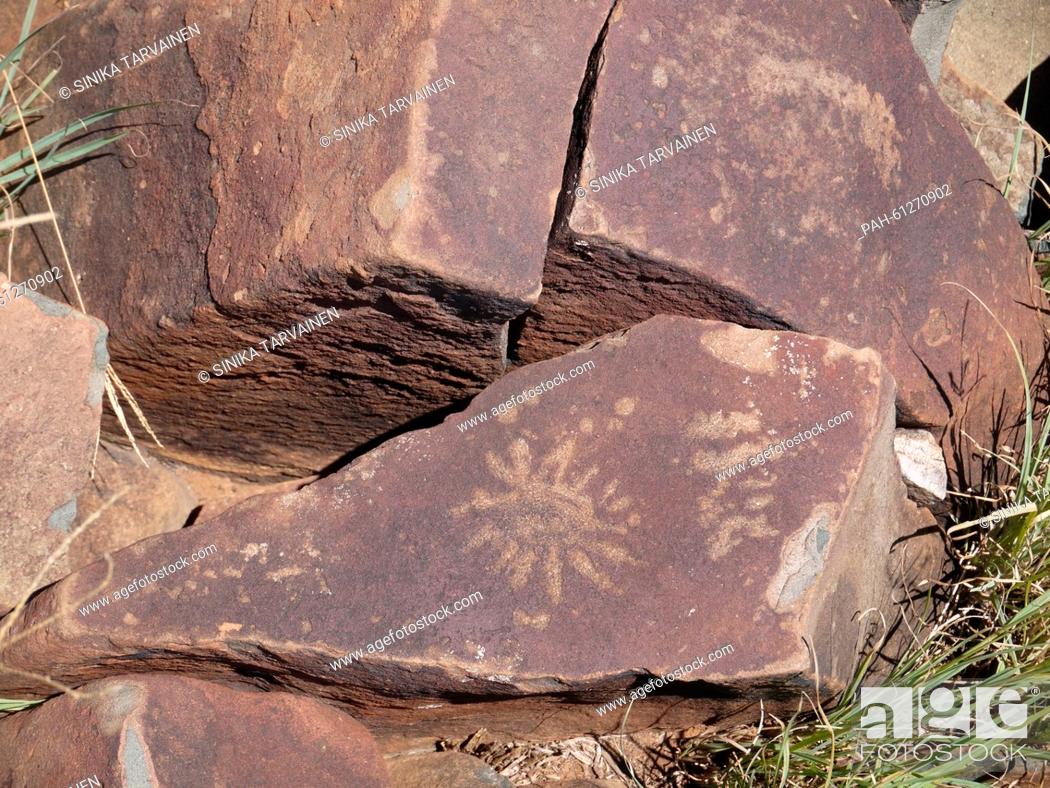 Stock Photo: A rock paintings of the sun, by the San people, in Wildebeest Kuil near Kimberley, South Africa, pictured 3 February 2015.