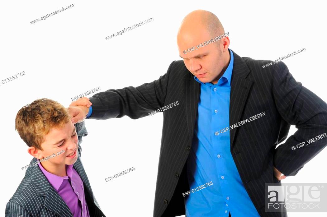 Photo de stock: Strict father punishes his son.