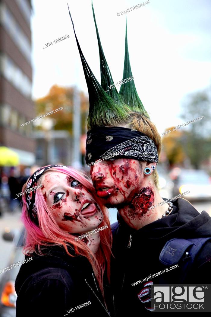 CANADA, TORONTO, , A punk rock couple dressed up for Halloween in  front of a punk rock..., Stock Photo, Picture And Rights Managed Image.  Pic. VIG-1880069 | agefotostock