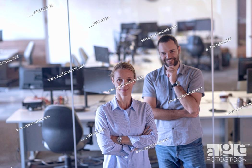Stock Photo: business couple working together on project at modern startup office.