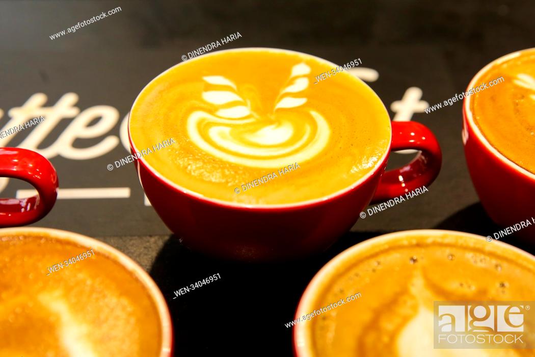 Stock Photo: Visitors attend The London Coffee Festival at The Old Truman Brewery. Now in its 6th year, the festival attracts thousands of visitors over the four day period.