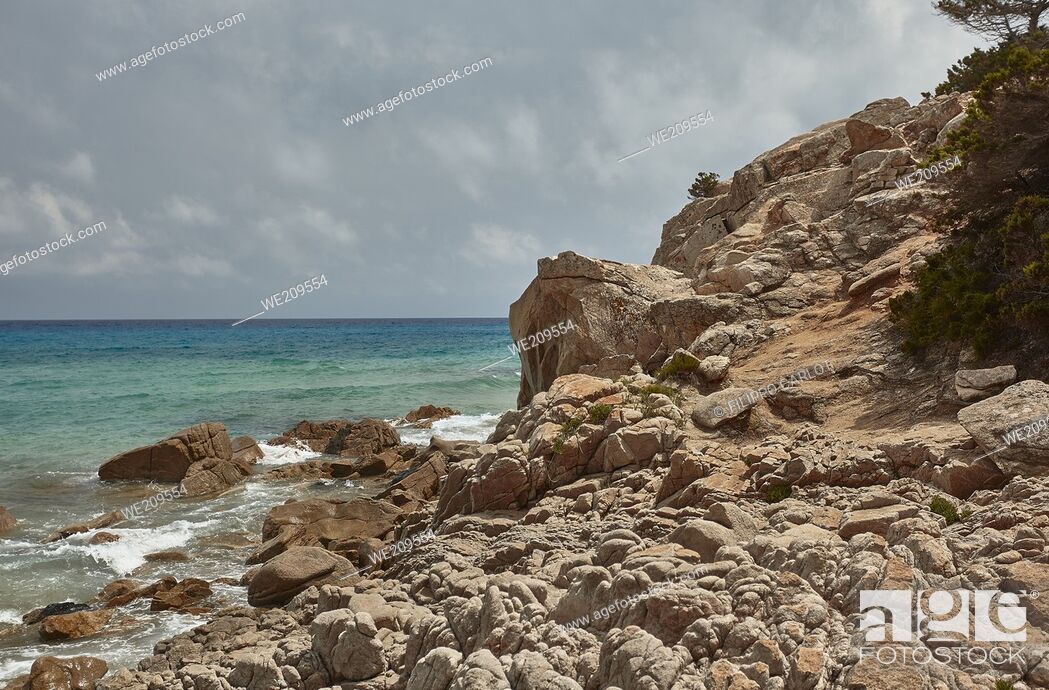 Stock Photo: Cliff overlooking the sea at Monte Turnu In Sardinia with its typical vegetation and the sea that breaks on the rocks.