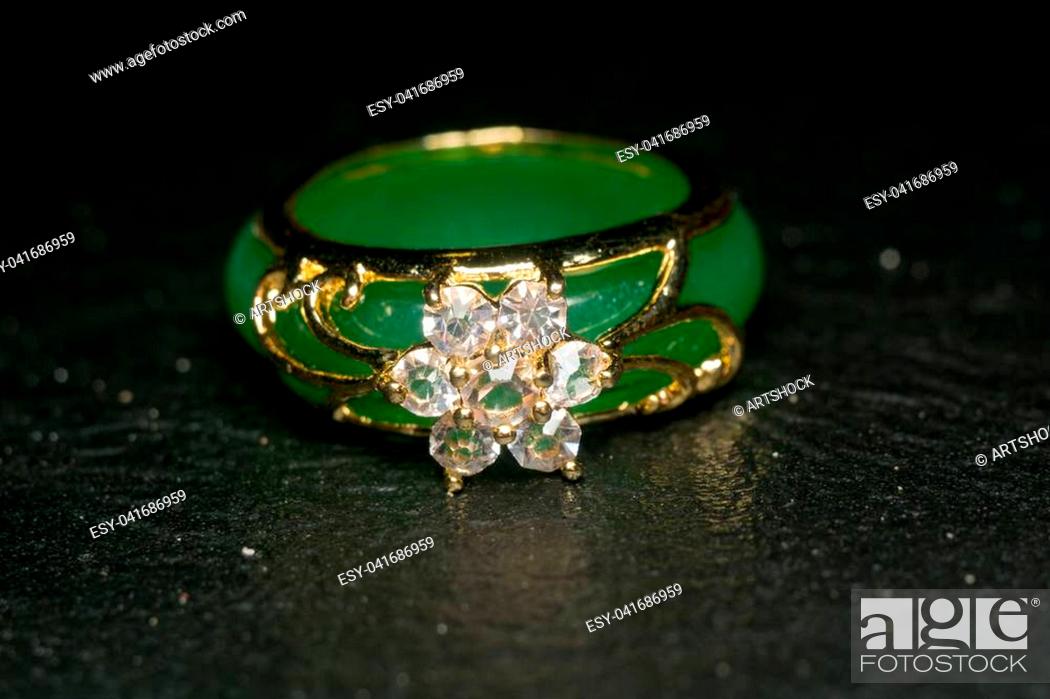 vergeetachtig Bukken mineraal Green jade ring decorated with diamonds and gold setting, Stock Photo,  Picture And Low Budget Royalty Free Image. Pic. ESY-041686959 | agefotostock