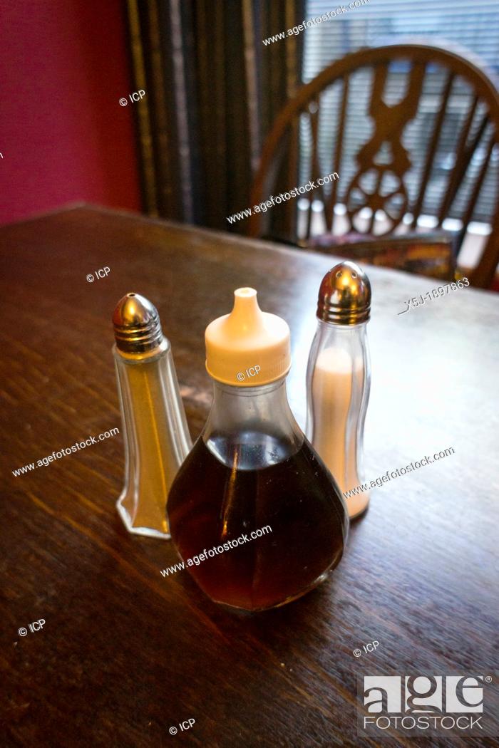 Stock Photo: Condiments set on a restaurant / pub table.