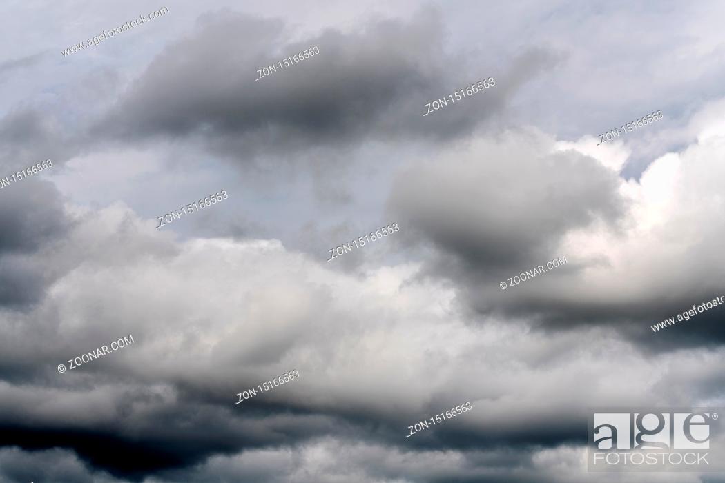 Stock Photo: Beautiful view of natural meteorology background - stunning cloud scape, dramatic clouds floating across sky to weather change before summer rain.