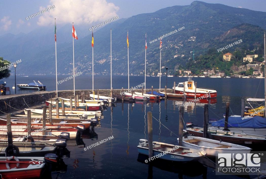 Imagen: Switzerland, Ticino, Ascona, Boats docked in the harbor along the lakefront of Lake Maggiore in the city of Ascona.