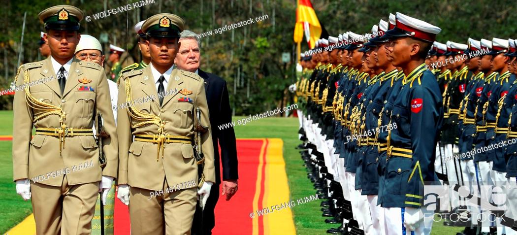 Stock Photo: German President Joachim Gauck is welcomed by Myanmar President Thein Sein (L) with military honours in Naypyidaw, Myanmar, 10 February 2014.