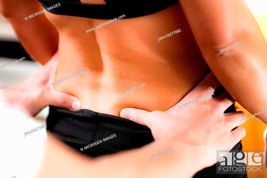 Stock Photo: Osteopathy treatment for lower back pain.