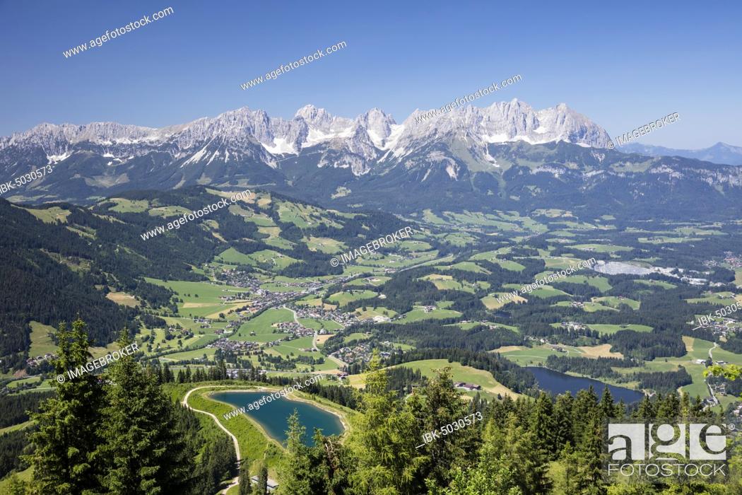 Stock Photo: View from the Hahnenkamm summit onto impounding reservoir and Lake Schwarzsee, near Kitzbühel, behind Wilder Kaiser, Kaiser Mountains, Alps, Tyrol, Austria.