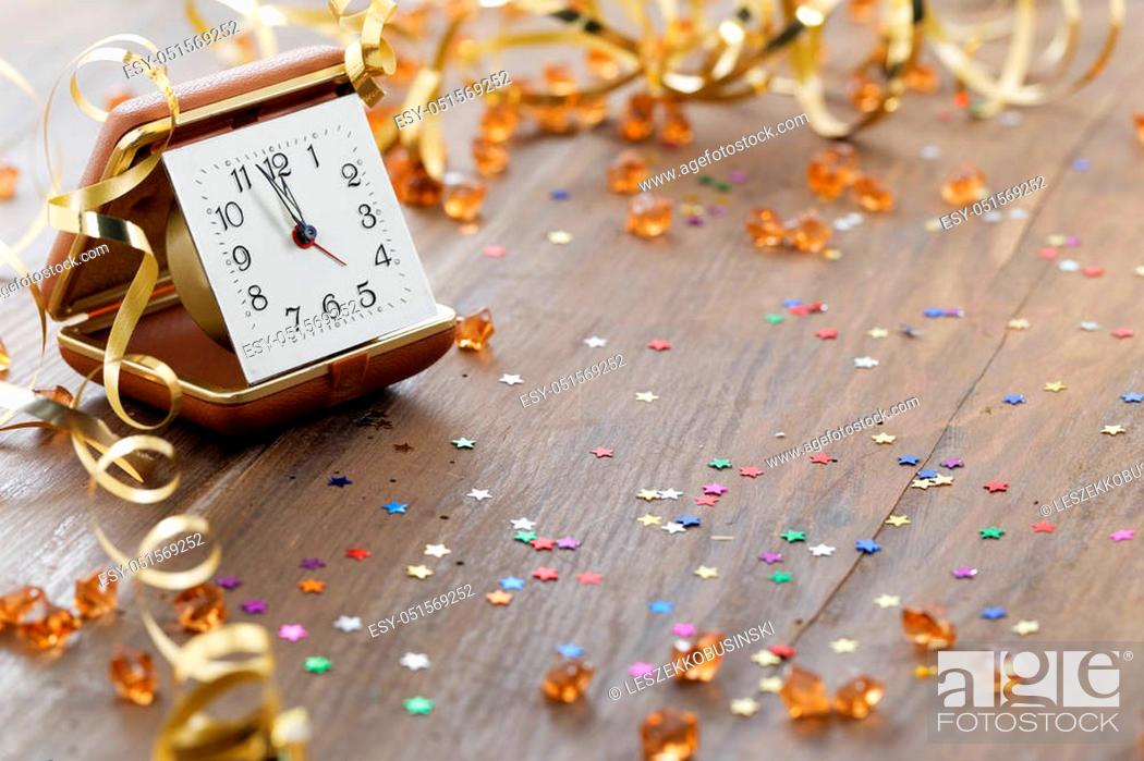 Stock Photo: Happy New Year. Old clock on abstract background.
