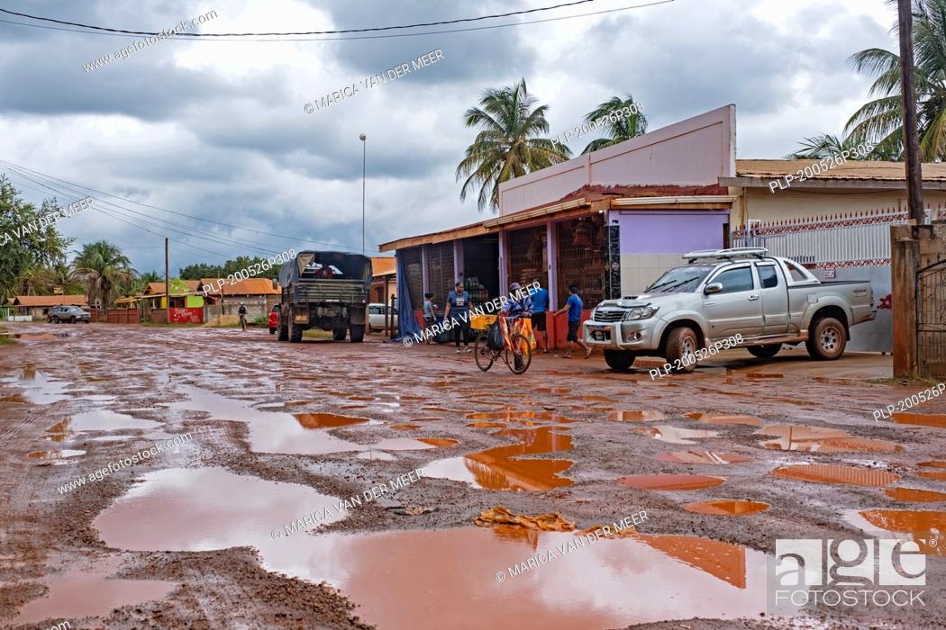Stock Photo: Grocery store along muddy dirt road in the village of Lethem during the rainy season, Upper Takutu-Upper Essequibo region, Guyana, South America.
