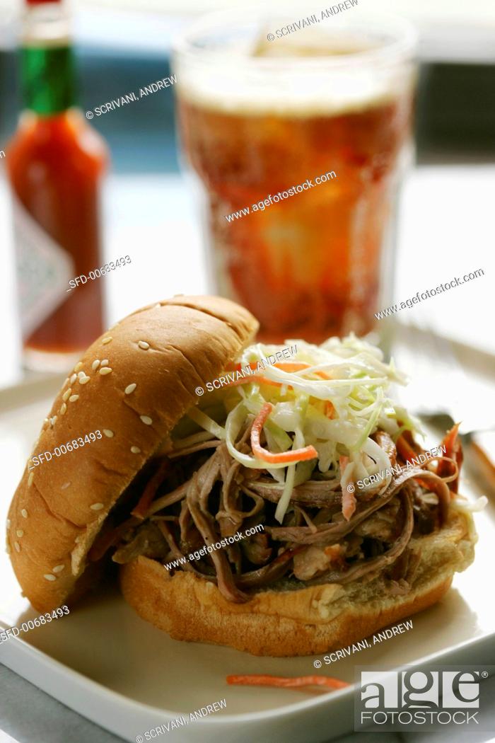 Stock Photo: Pulled Pork Sandwich with Cole Slaw; Soda.