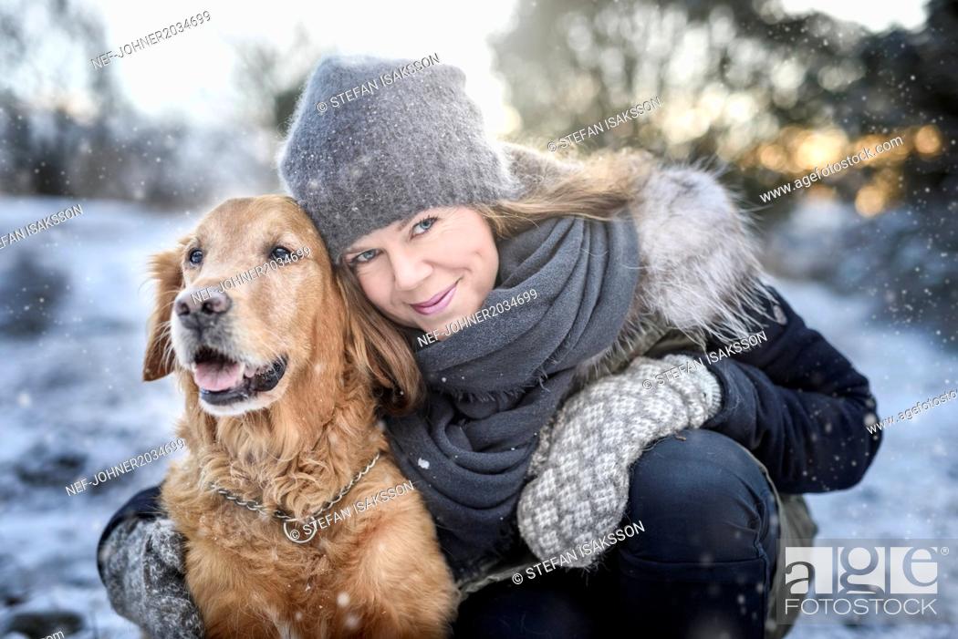 Stock Photo: Portrait of smiling woman with dog.