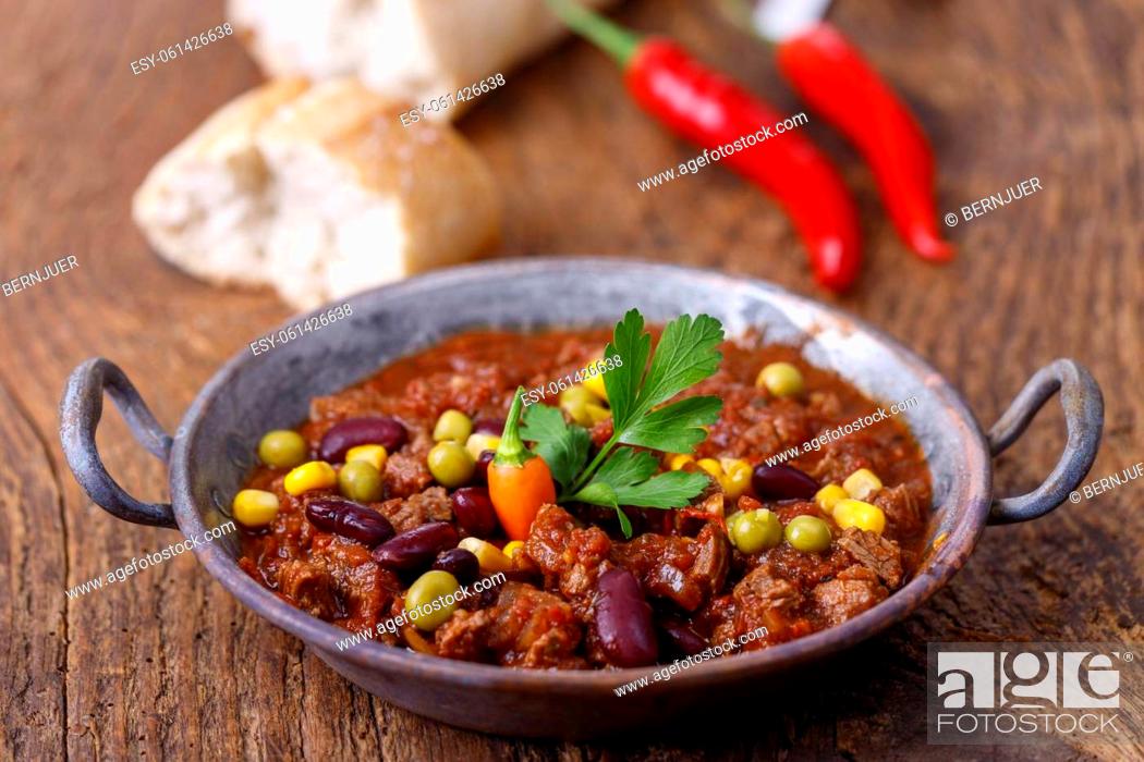 Stock Photo: tasty chili con carne on wood.