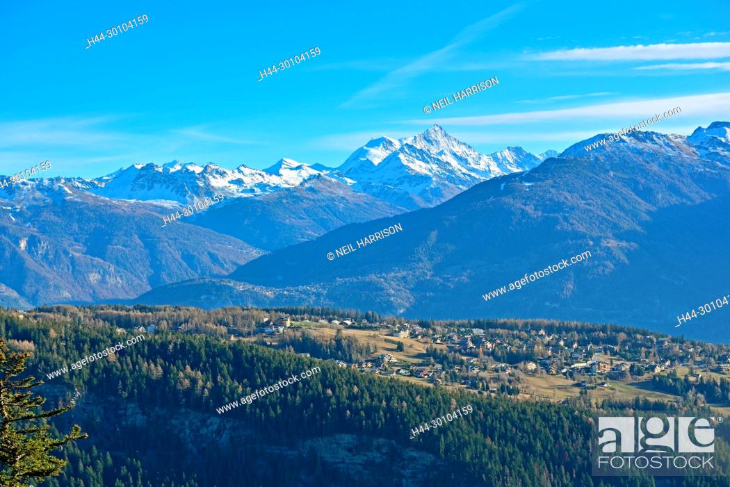 Stock Photo: The Swiss Alpine village of Len with the high peak of the Weisshorn in the background.