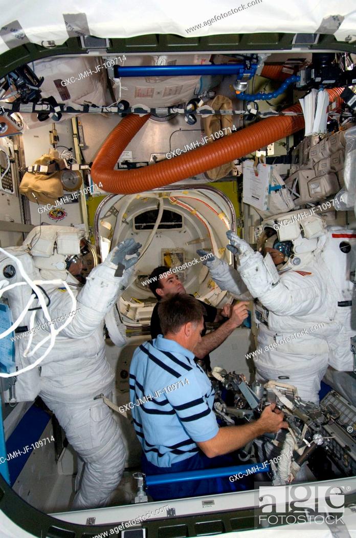 Stock Photo: Attired in their Extravehicular Mobility Unit (EMU) spacesuits, astronauts Heidemarie Stefanyshyn-Piper (right) and Steve Bowen.