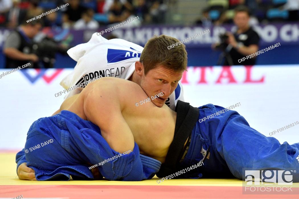 Stock Photo: Czech judoka Pavel Petrikov (in white) competes during the match against Strahinja Buncic from Serbia during 3rd round of men's 66kg class in World Judo.