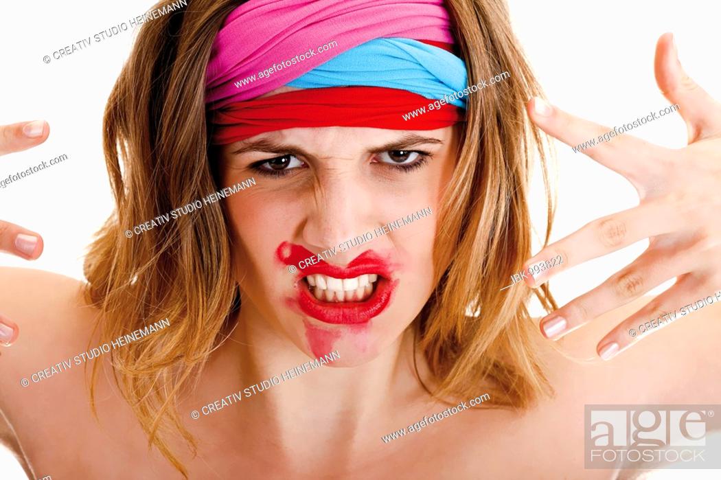 Stock Photo: Young woman with colourful headbands and smeared lipstick.