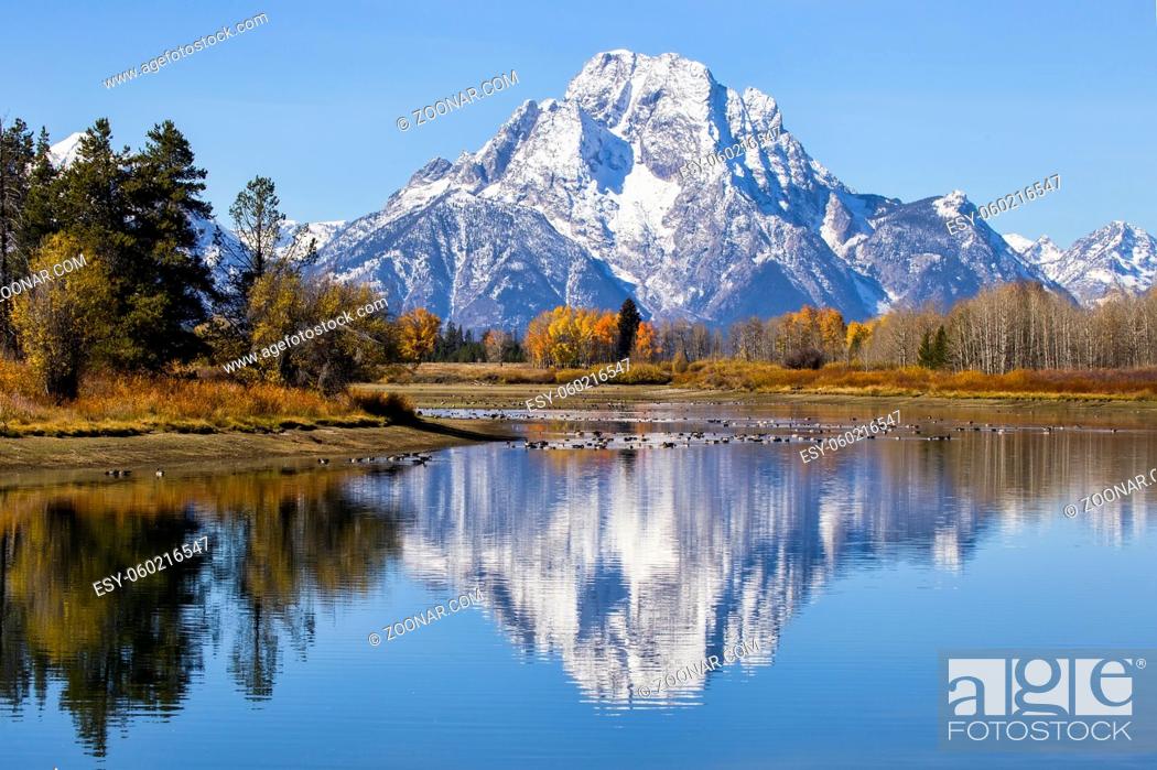Stock Photo: Oxbow Bend at Grand Teton National Park during the colorful fall season. Mount Moran is reflected in the river.
