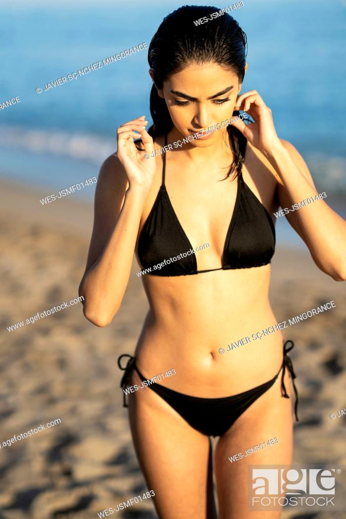 vice versa Vrijlating Einde Young woman wearing bikini enjoying while walking at beach against sea,  Marbella, Andalusia, Spain, Stock Photo, Picture And Royalty Free Image.  Pic. WES-JSMF01483 | agefotostock