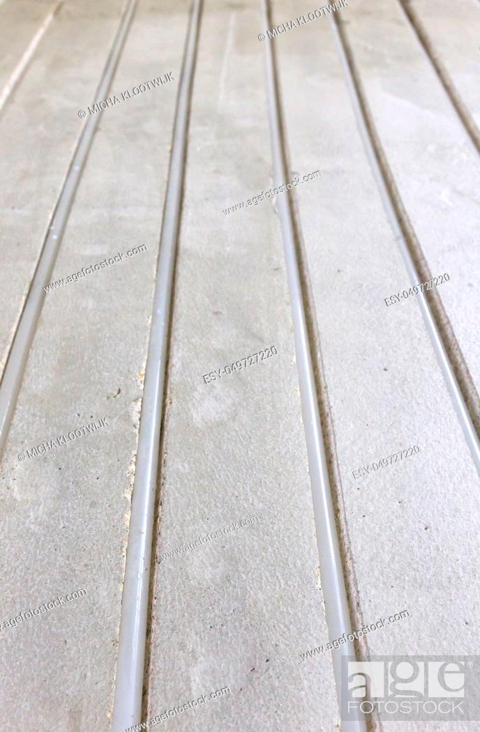 Stock Photo: Water underfloor heating pipes in a concrete floor.