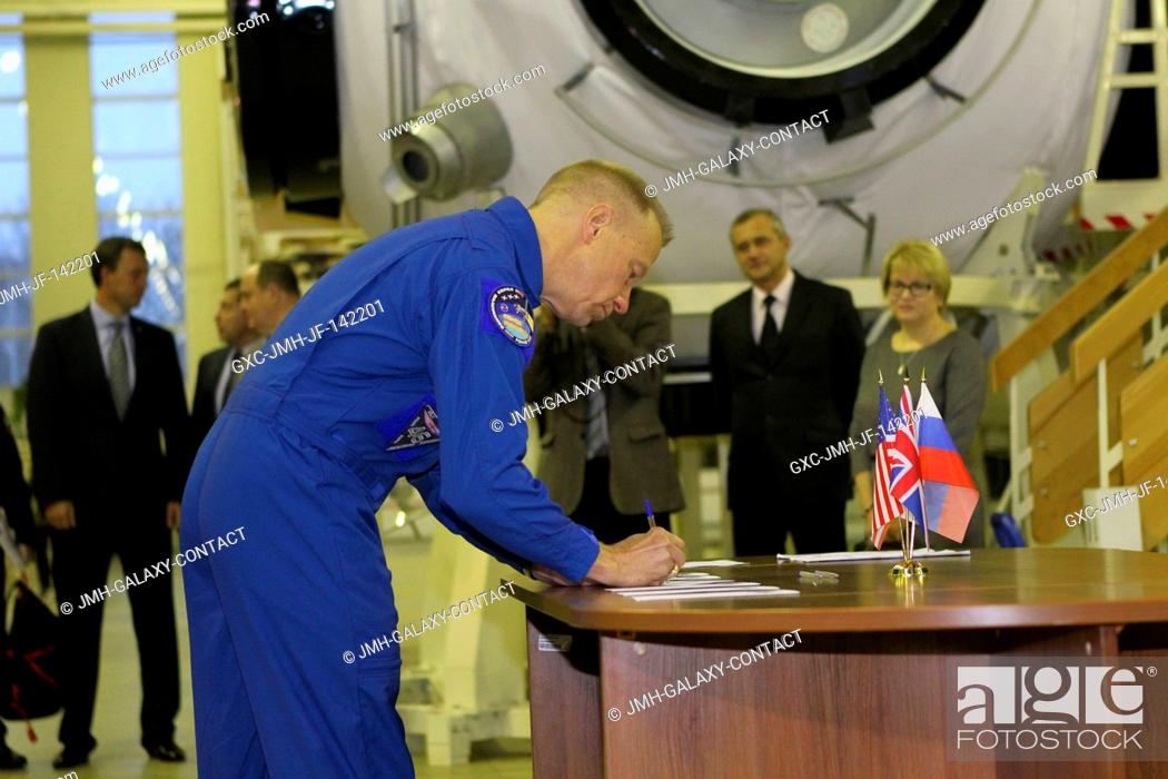 Stock Photo: At the Gagarin Cosmonaut Training Center in Star City, Russia, Expedition 46-47 prime crewmember Tim Kopra of NASA signs in for the start of two days of.