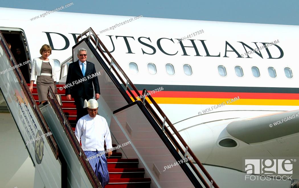 Stock Photo: German President Joachim Gauck and his partner Daniela Schadt leave the government plane in Naypyidaw, Myanmar, 10 February 2014.
