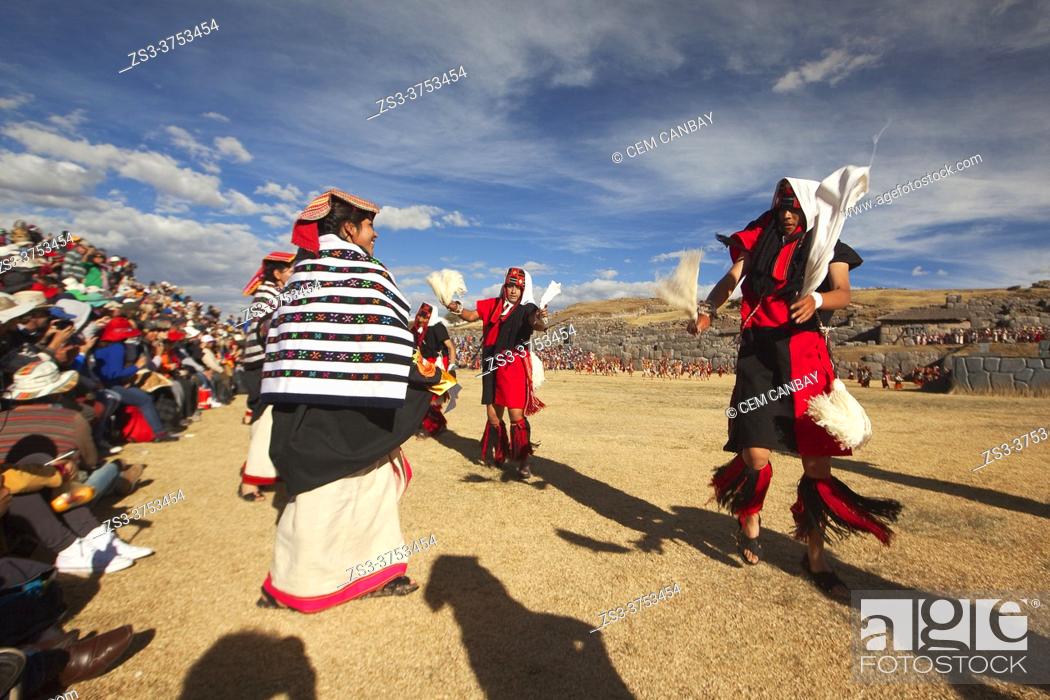 Stock Photo: Indigenous people with traditional costumes during a performance at the Inti Raymi Festival 2018 in Saqsaywaman Archaeological Site, Cusco, Peru, South America.
