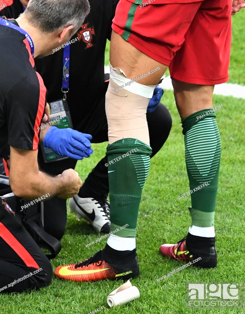 Cristiano Ronaldo of Portugal receives some medical aid after a leg injury during the UEFA EURO 2016..., Photo, Picture And Rights Managed Image. Pic. PAH-81944241 | agefotostock