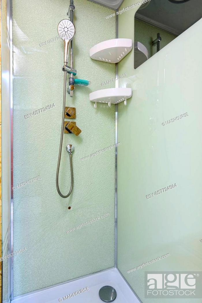 Stock Photo: Cracked rear window of the shower stall.