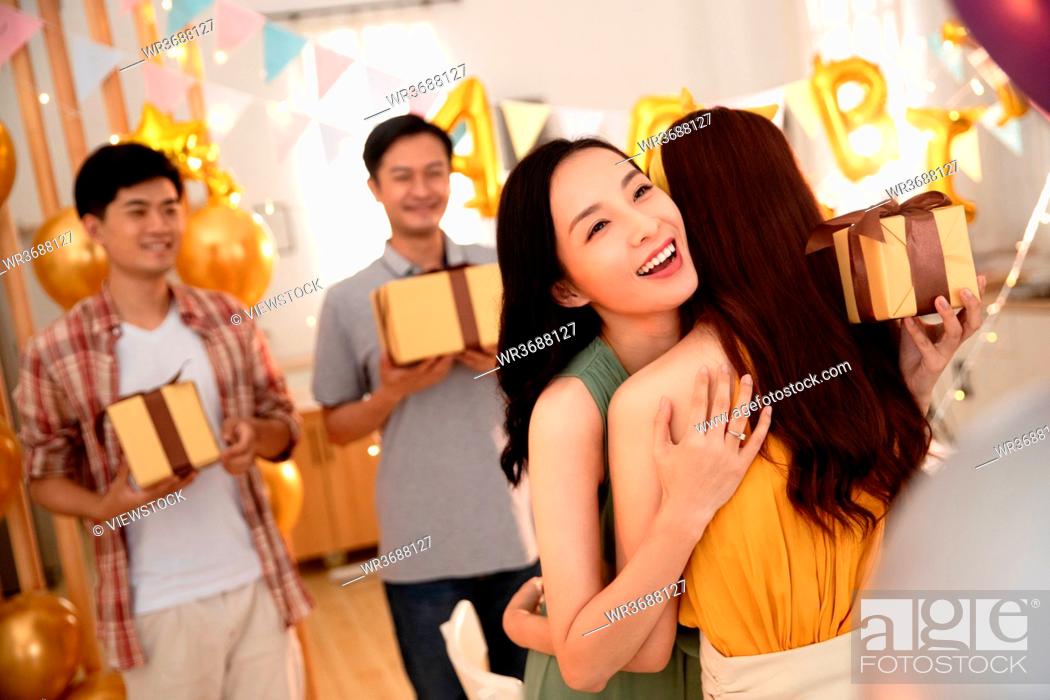 Stock Photo: Happy young friends celebrate birthday.