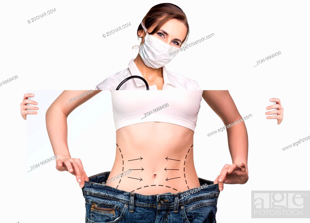 Stock Photo: Female doctor holds placard with woman battocks and correction lines on them. Plastic surgery concept.