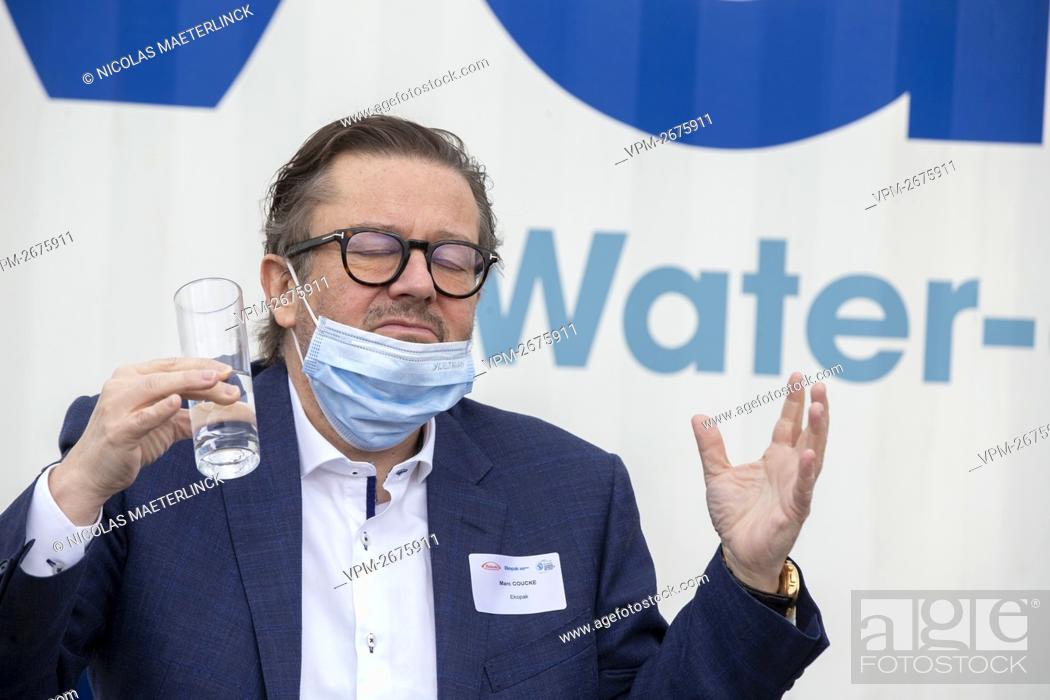 Stock Photo: Belgian businessman Marc Coucke drinks a glass of water at the opening of a wastewater recycling facility on the site of the pharmaceutical firm Takeda.