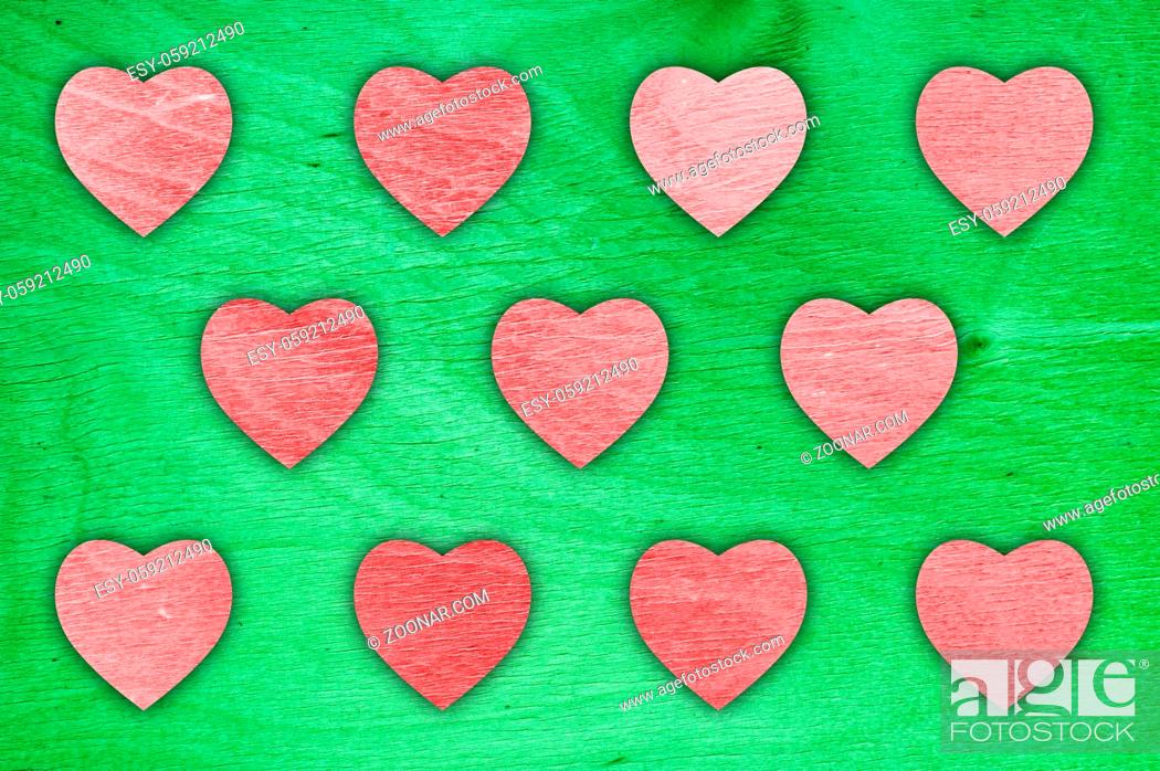 Stock Photo: Happy valentines day colorful wooden background with coloured hearts.