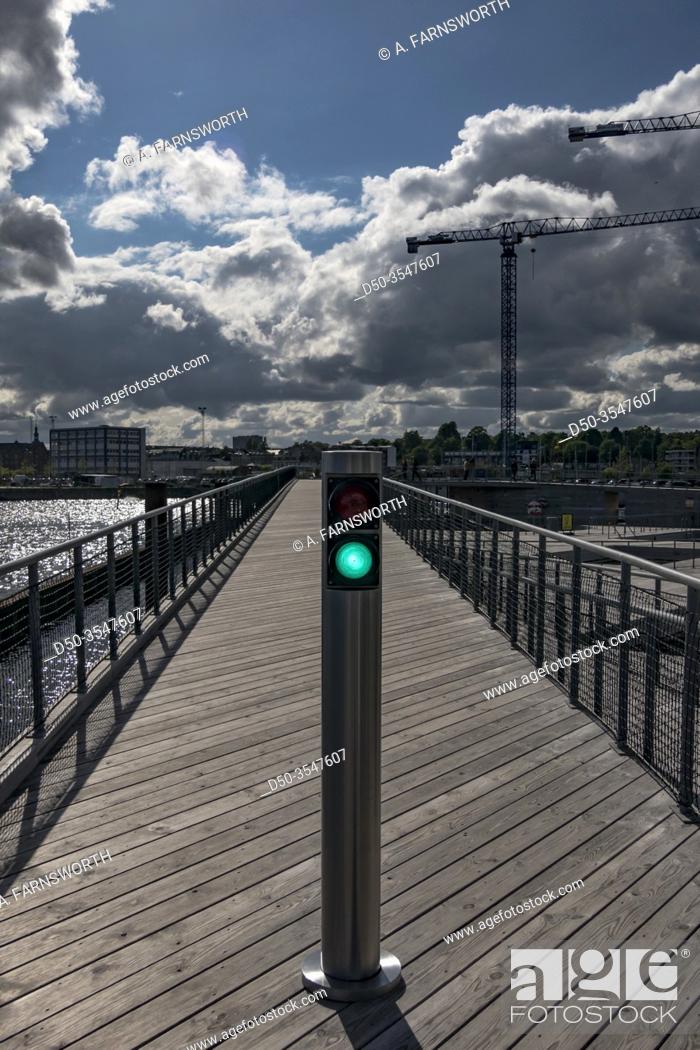 Stock Photo: Aarhus, Denmark A green light on a walkway in the new Docklands urban and residential development project.