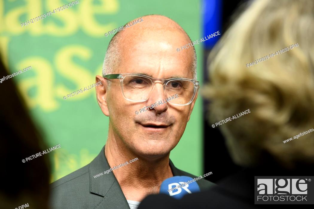 Stock Photo: 29 September 2021, Bavaria, Munich: The leading actor Christoph Maria Herbst gives an interview to Bayerischer Rundfunk at the premiere of the comedy ""Es ist.