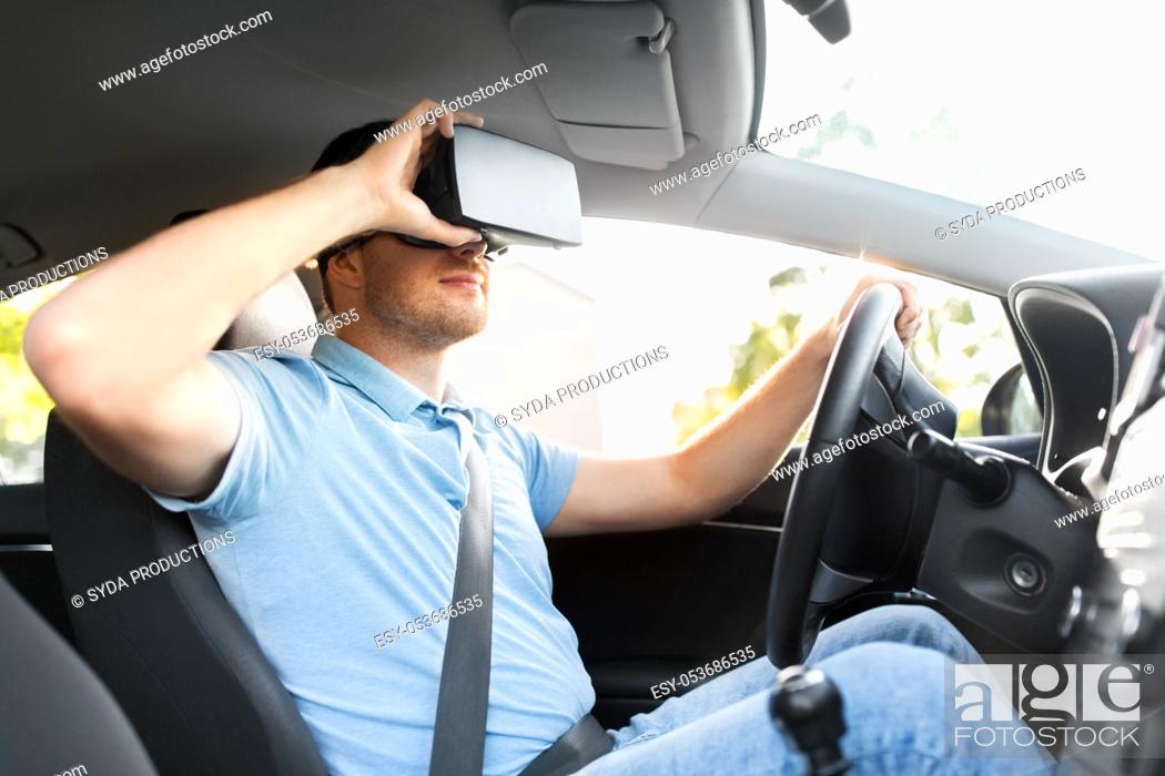 Stock Photo: man or driver wearing vr glasses and driving car.