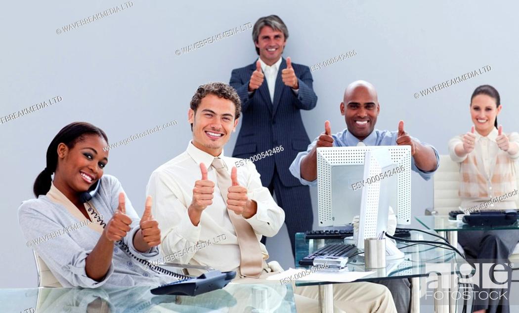 Stock Photo: Portrait of a successful business team at work in the office.