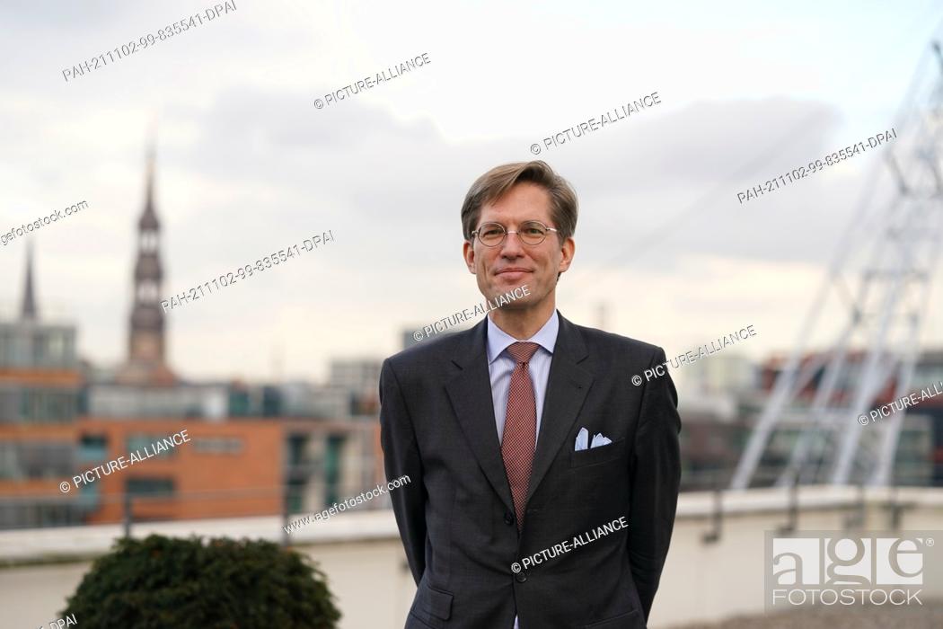 Stock Photo: 02 November 2021, Hamburg: Nils Weiland, deputy chairman of the Hamburg SPD, stands on a roof terrace in Hafencity. The Hamburg SPD is to be led by a dual.