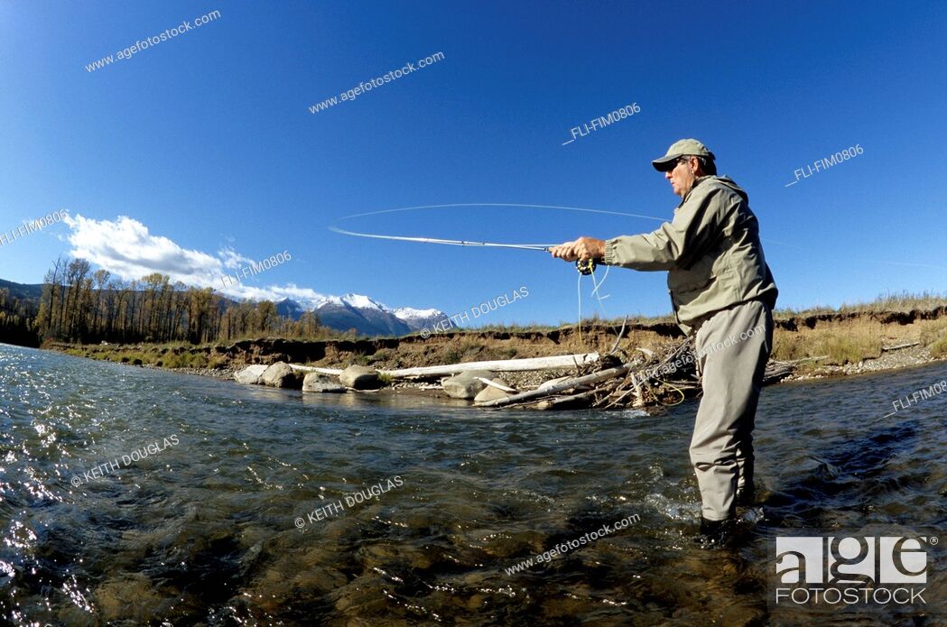 Stock Photo: Angler Fly-fishing, Bulkley River, Smithers, British Columbia.