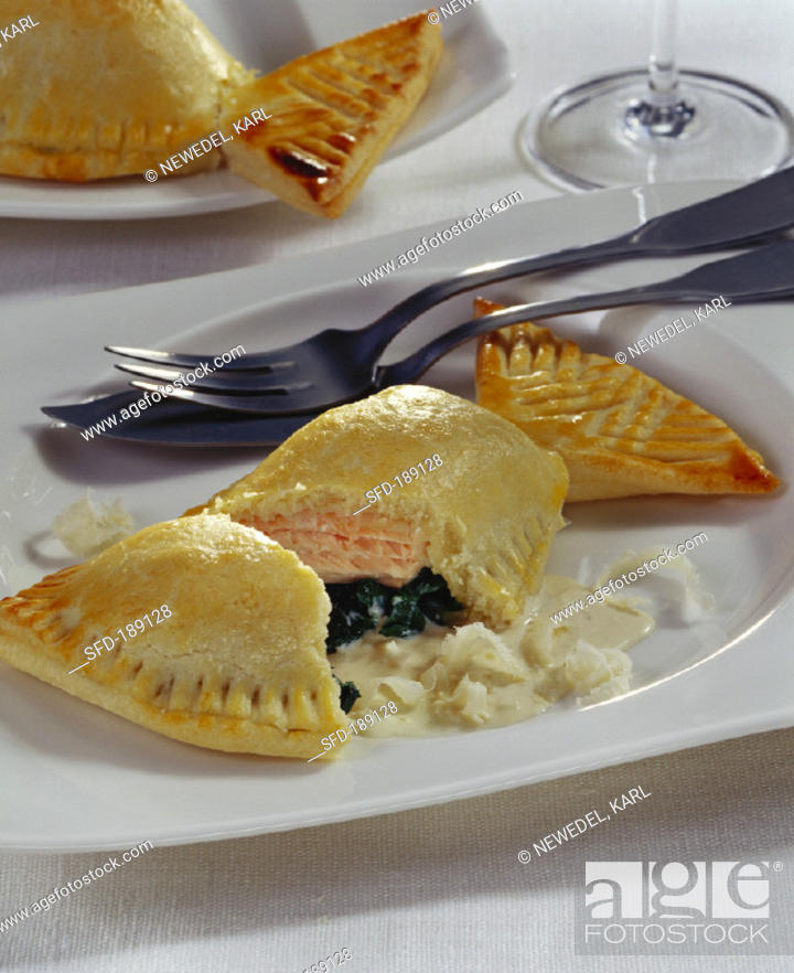 Stock Photo: Salmon and spinach pierogi (pasties) with horseradish.
