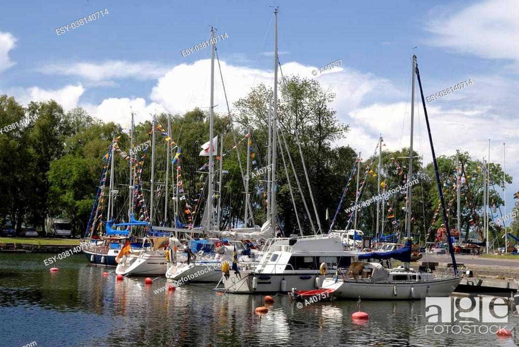 Stock Photo: Small sailboats in a Vadstena harbor.